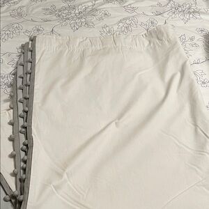 Pair of white Pottery Barn Pom-Trim Curtains